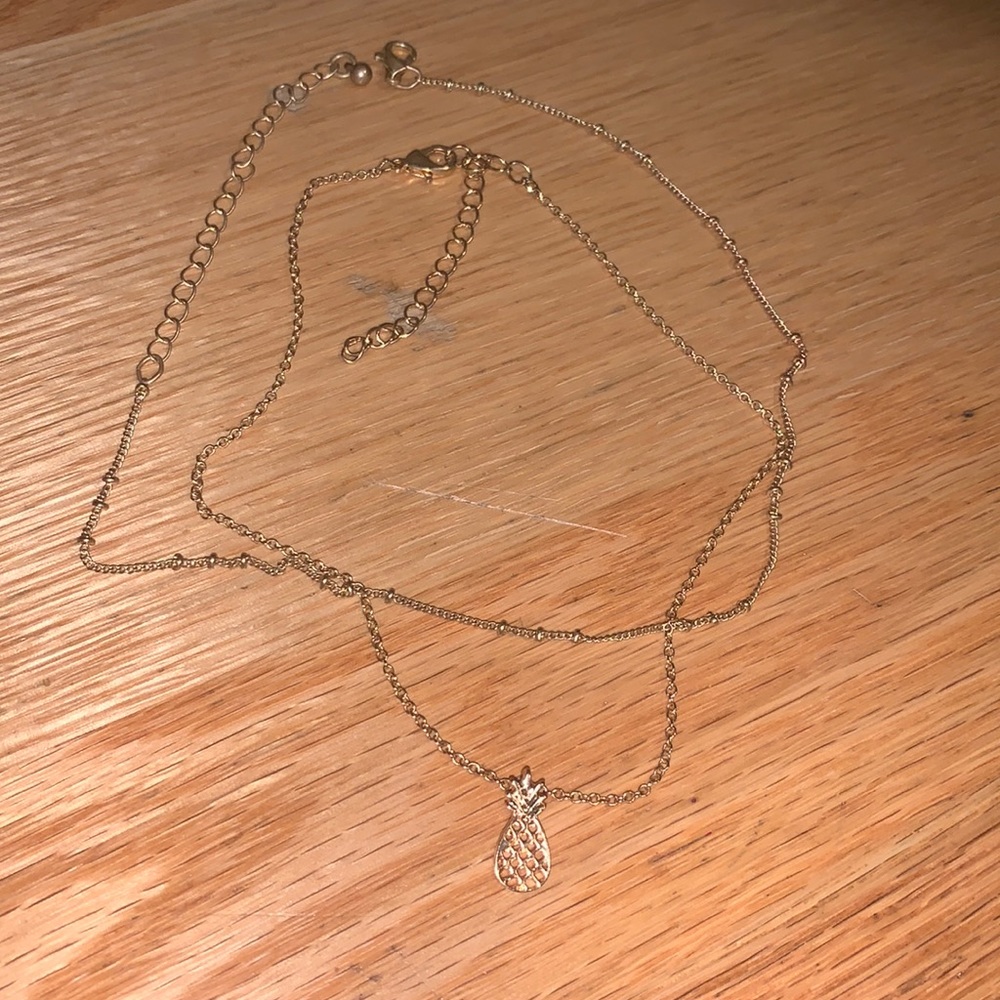 Two gold stackable chokers